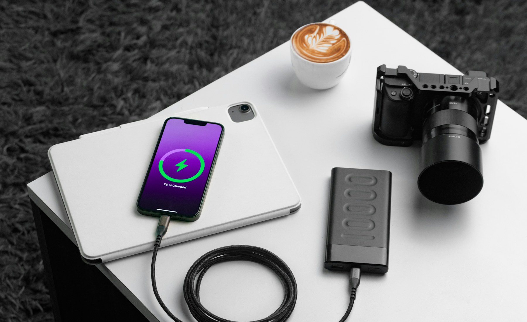 Charging accessories arranged on a modern technology workspace